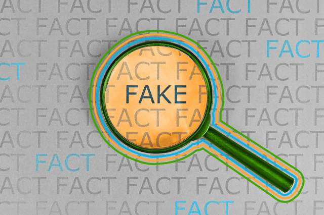 The word "fake" highlighted by magnifying glass