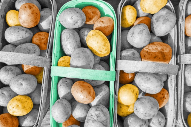 Multiple baskets full of potatoes