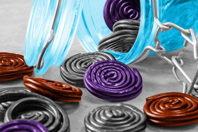Spirals of licorice tumbling out of a jar