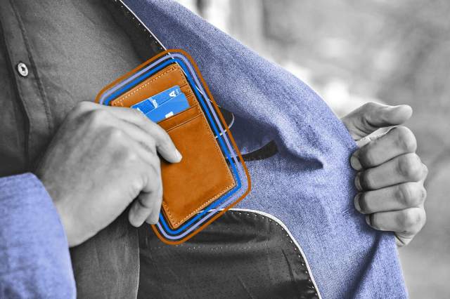 Man pulling wallet out of coat