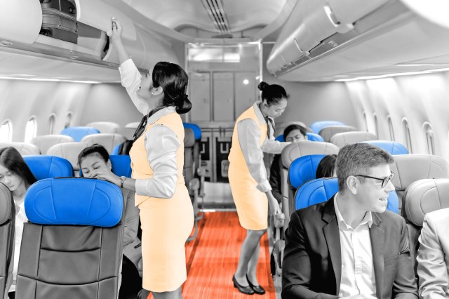 Flight attendants working on an airplane
