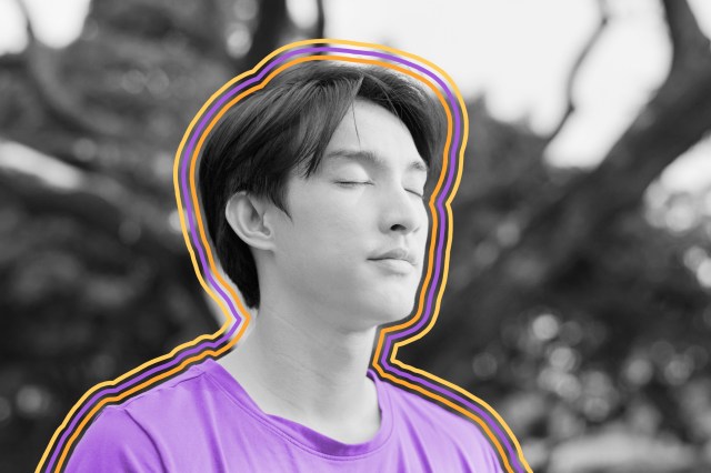 Close-up of man meditating with eyes closed