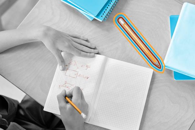 Student writing in a notebook