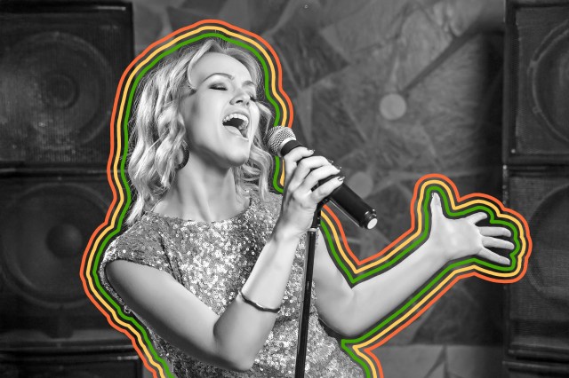 Woman singing into a microphone