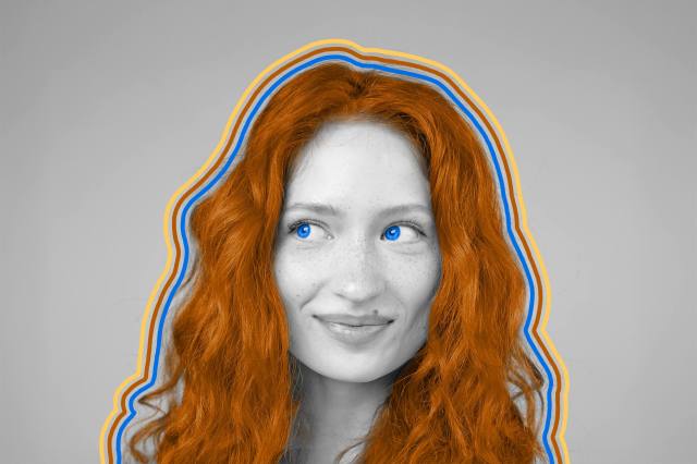 Close-up of a red-haired, blue-eyed woman