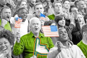 Crowd of Americans singing with flags in hand